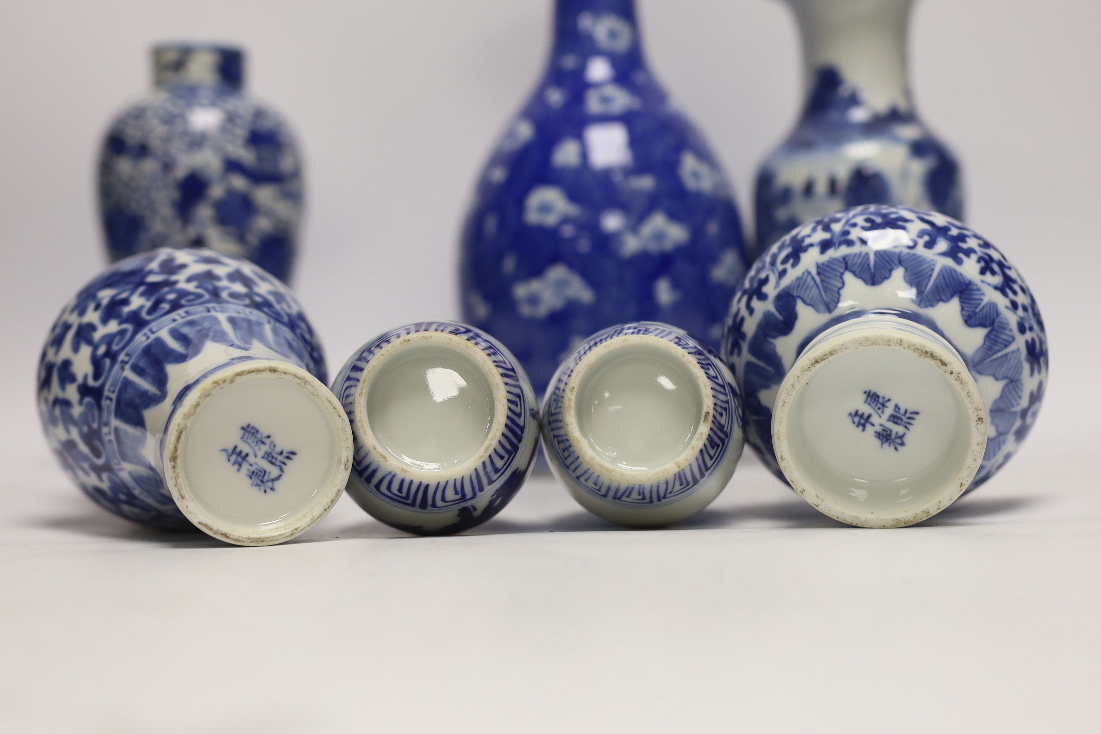 Seven Chinese or Japanese blue and white vases, late 19th/early 20th century, largest 27cm high